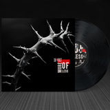 Vinyl record with a thorny design and 'More or Less' text on a black background