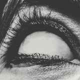Album cover for A Place To Bury Strangers "Pinned" with a close-up of a person's eye with detailed eyelashes and skin texture.