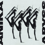 Album cover for Anika's "Abyss" with a black and white advertisement for Armani with abstract human figures.
