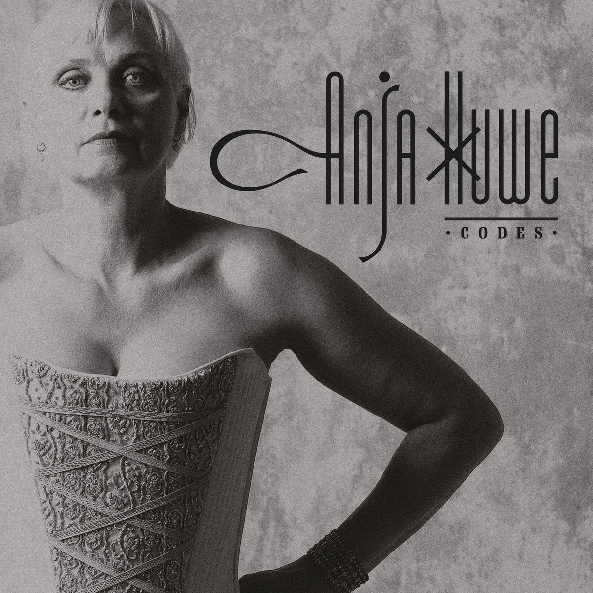 Black and white album cover with a person wearing an ornate dress and the text 'Anja Kuwe Codes'.