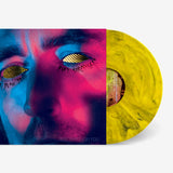 Vinyl record with a colorful design of a face on the cover
