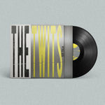 Vinyl record with 'The Twits' album cover on a light gray background