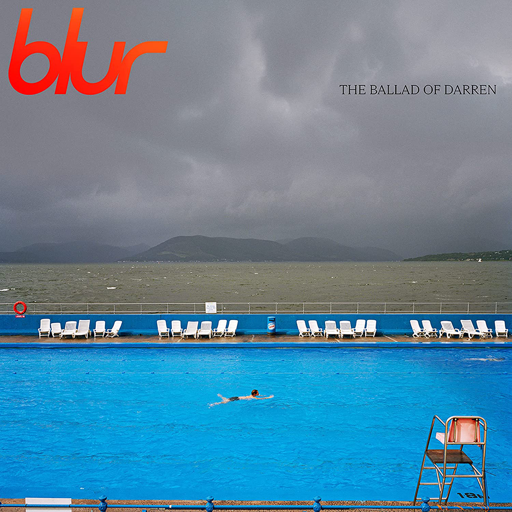 A person swimming in a pool with lounge chairs and a stormy sky, featuring the album cover of 'The Ballad of Darren' by Blur.