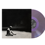 Vinyl record with a purple disc and black cover featuring a person sitting on the ground.