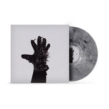 Vinyl record with cover eaturing a black silhouette of a spiky gloved hand on a white background