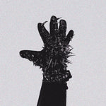 Black glove with spikes on a light gray background