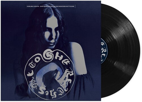 Vinyl record with a cover featuring a person and album art, on a white background.