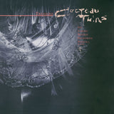 Album cover for 'Treasure' by Cocteau Twins with intricate design and text on a dark background