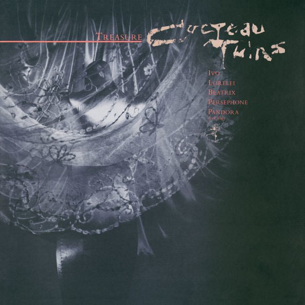 Album cover for 'Treasure' by Cocteau Twins with intricate design and text on a dark background