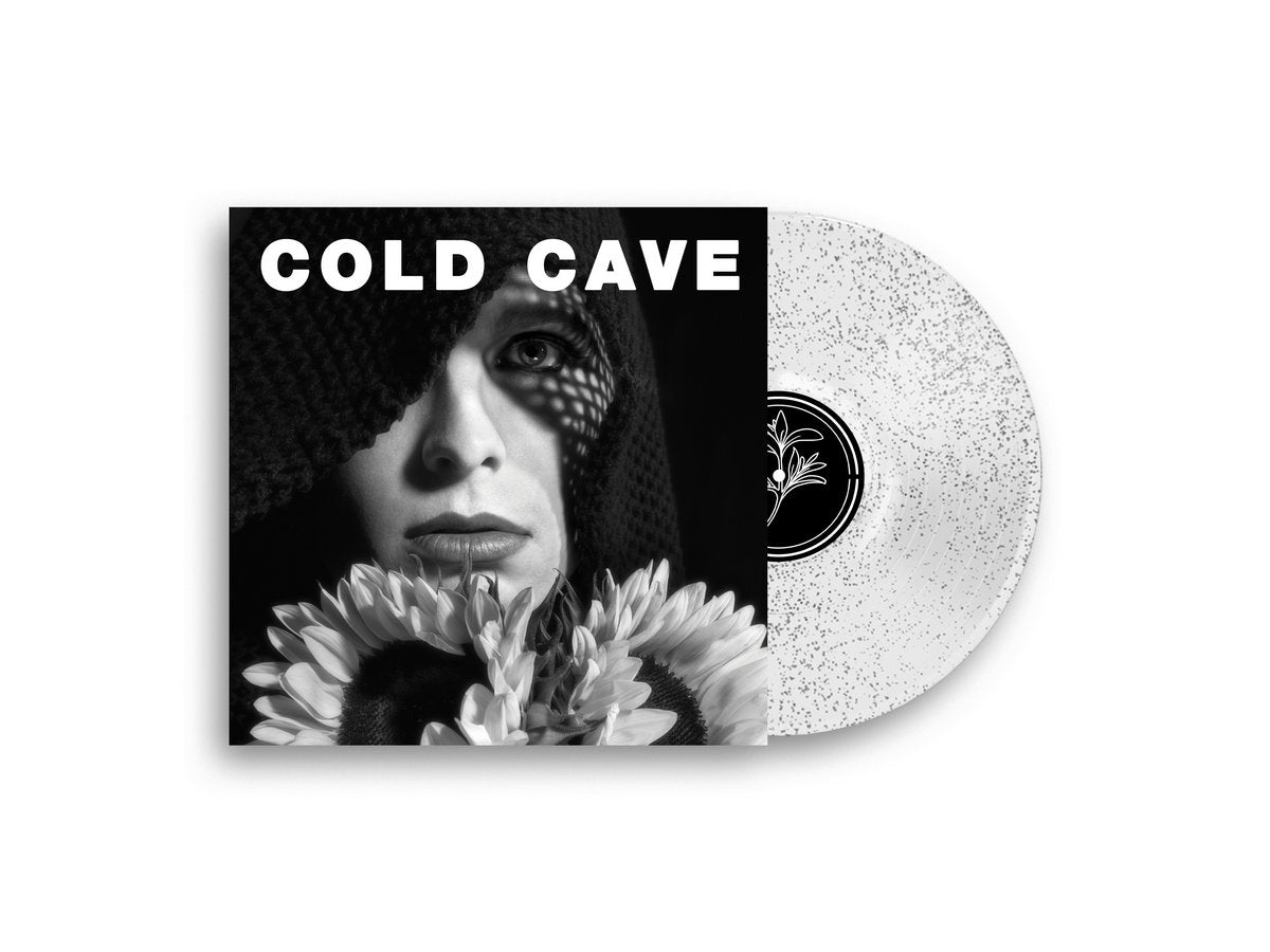 Vinyl record with a black and white cover featuring a person and flowers, labeled 'Cold Cave'.