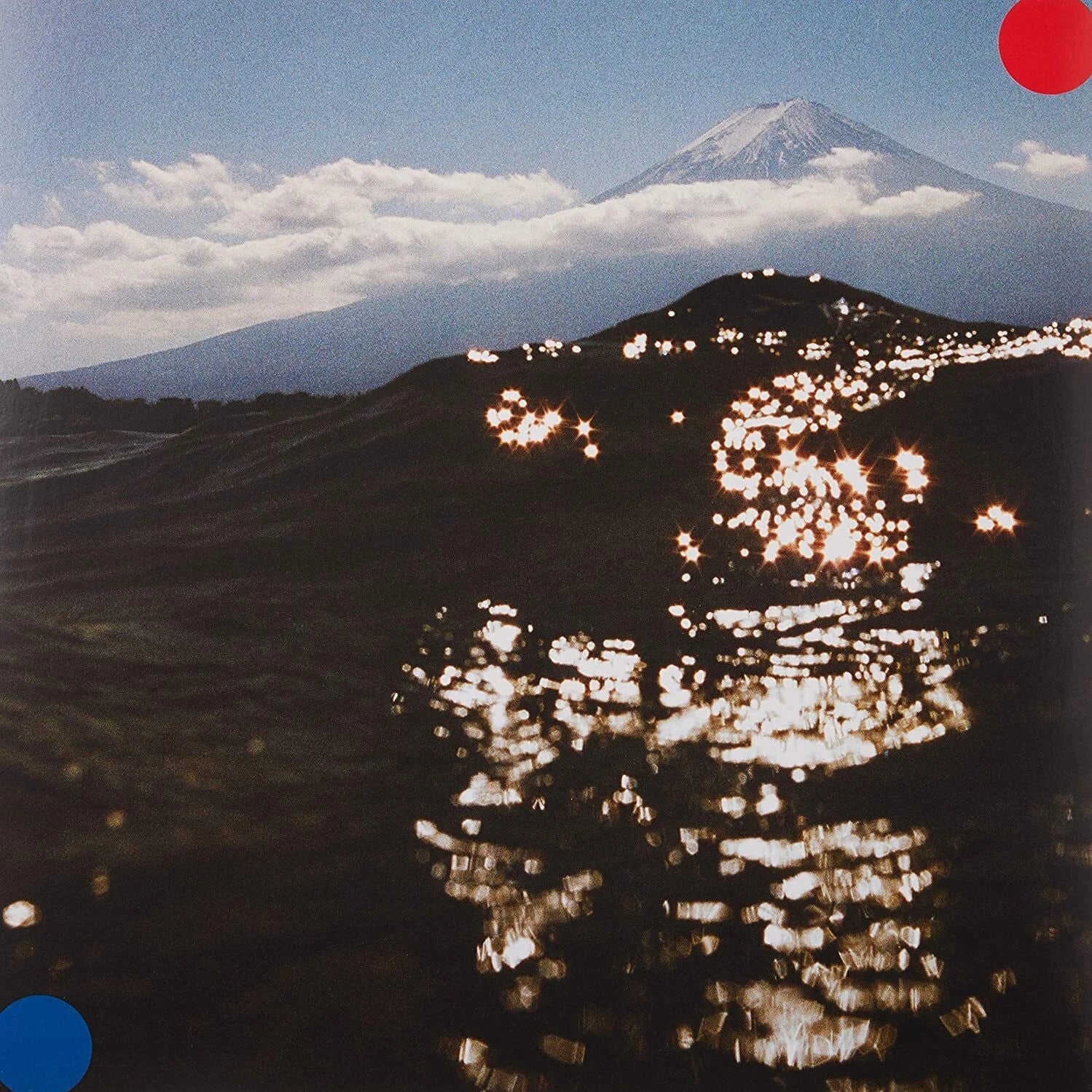 Album cover for 'Freeze Melt' by Cut Copy featuring snow-capped mountain in the horizon with sparkly waves in the forefront.