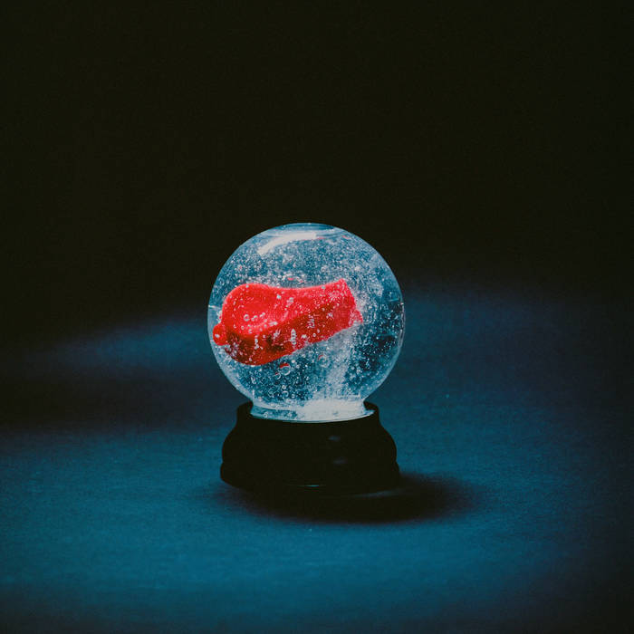 Album cover for 'Nothing' by Darkside featuring a crystal ball with a red airplane inside on a dark background