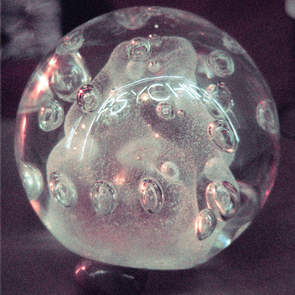 Album cover for 'Psychic' by Darkside with a clear glass sphere with 'BUBBLE PSYCHE' branding on a dark background