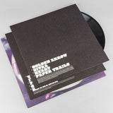 Vinyl record with a black cover featuring text on a white background