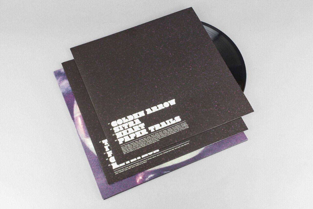 Vinyl record with a black cover featuring text on a white background