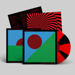 Vinyl record with colorful cover design on a gray background