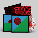 Vinyl record with colorful cover design on a gray background