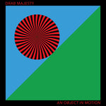 Album cover with a red and black circular design on a blue and green background, featuring the text 'Drab Majesty' and 'An Object in Motion'.