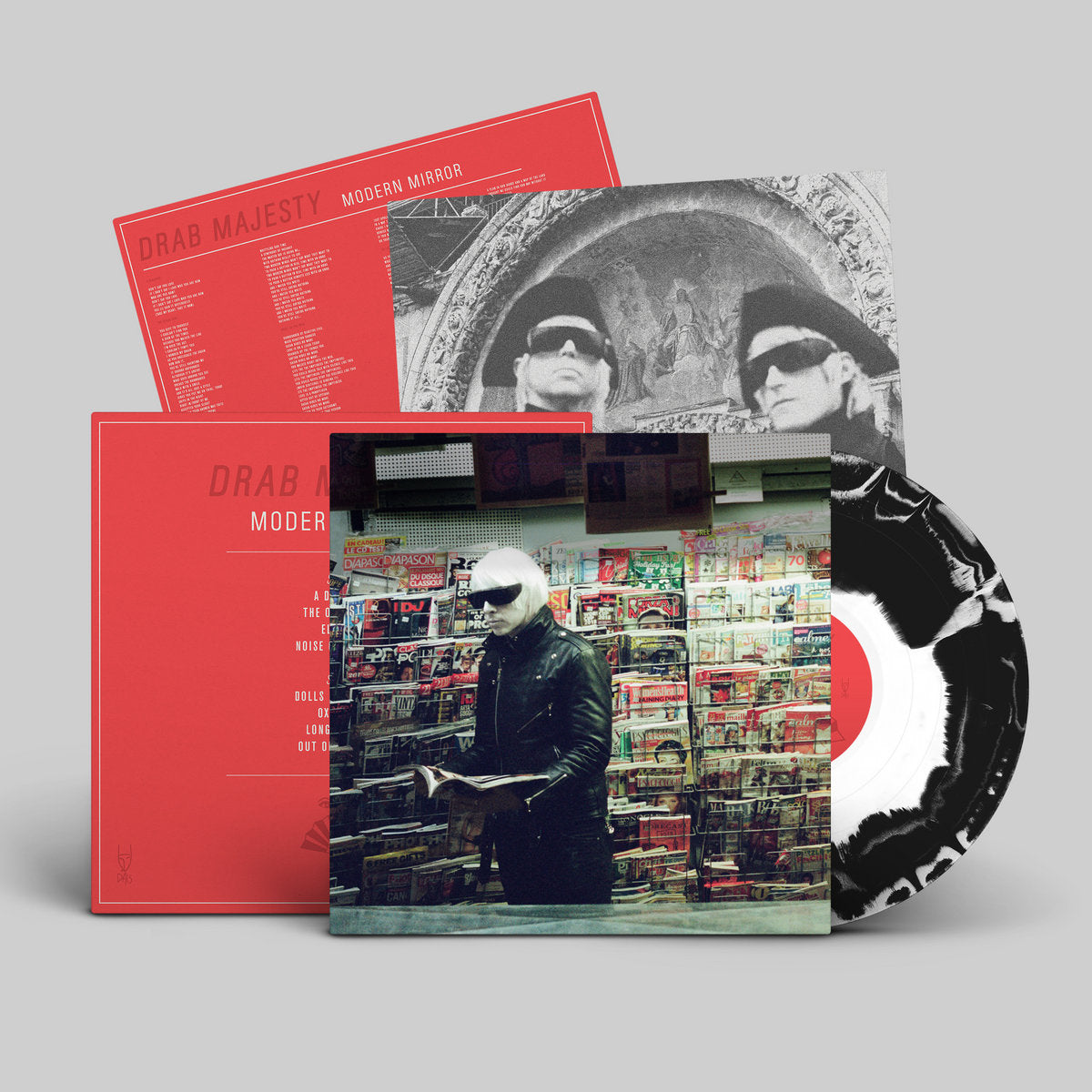 Vinyl record set with cover and disc on a gray background