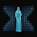 Album cover for Drab Majesty's 'The Demonstration' featuring a figure in a white robe standing between large blue glass blocks on a black background