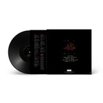 Black vinyl record with a white label on a white background