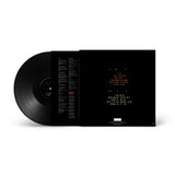 Black vinyl record with a white label on a white background