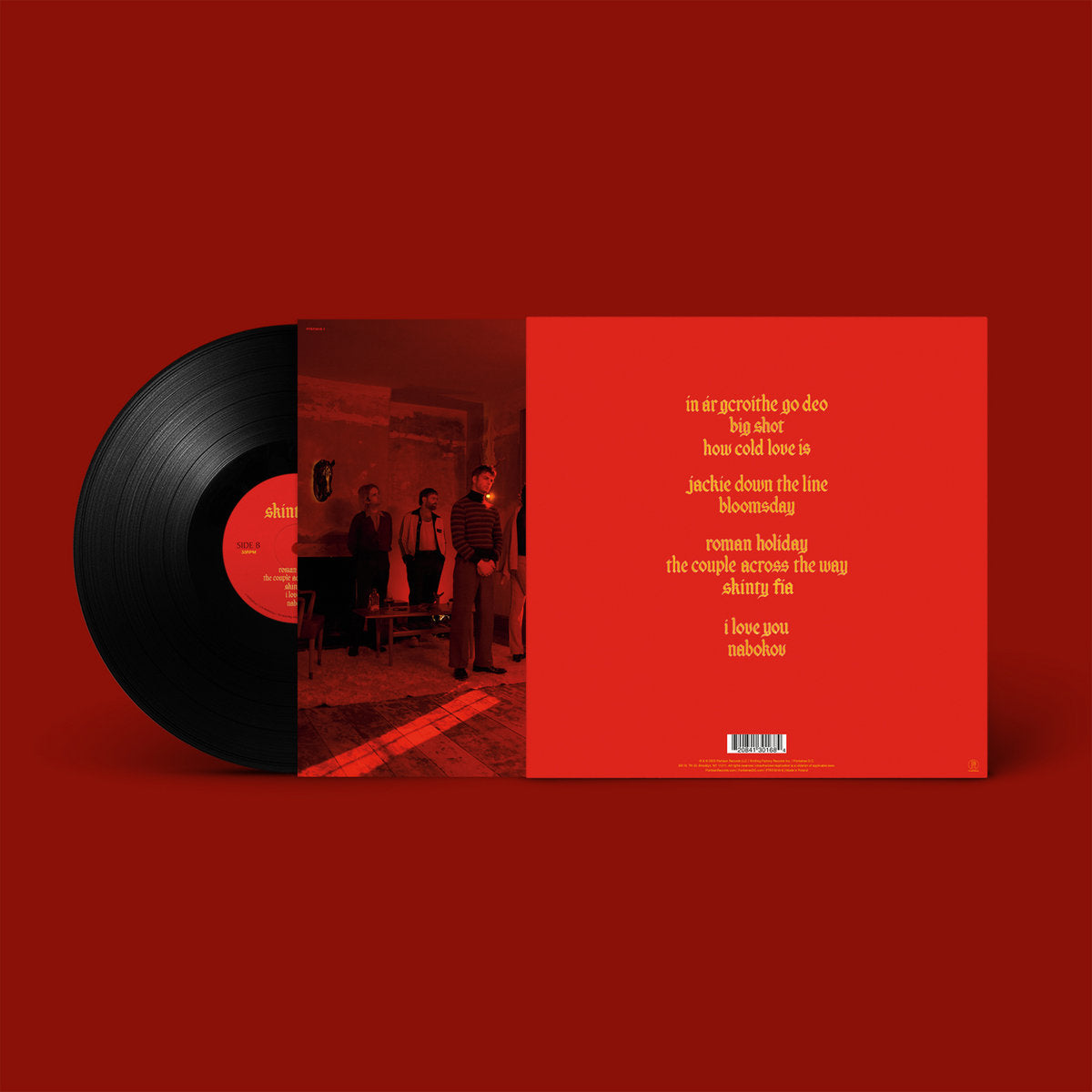 Vinyl record with red cover featuring album tracklist on a red background