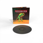Vinyl record with 'Grinderman' cover featuring a colorful monkey illustration on a white background