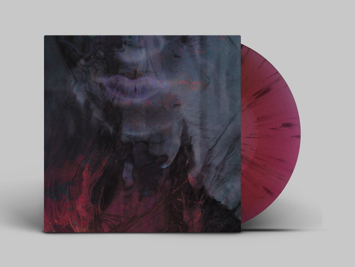 Vinyl record with a pink disc and cover featuring a wolf design on a gray background