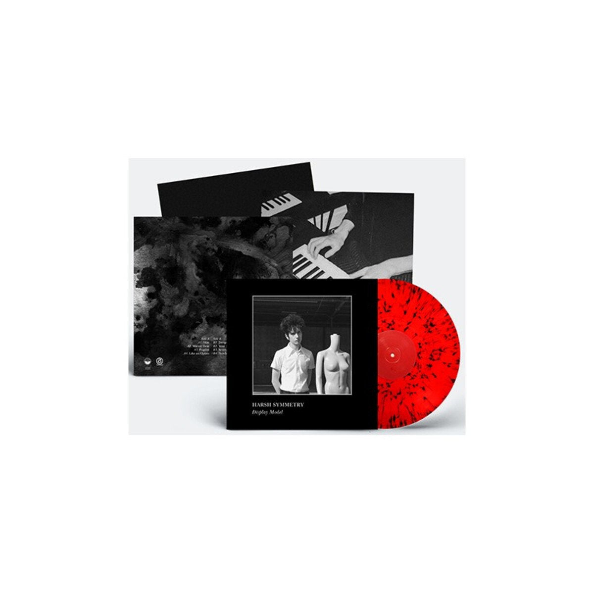 Vinyl record with red and black design and cover featuring two figures.