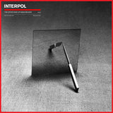 Album cover for Interpol's 'The Other Side of Make Believe' with a black and white photo and red border.