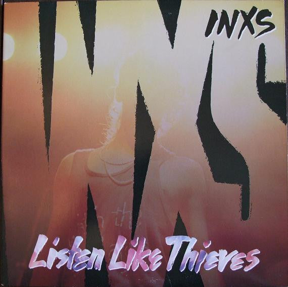 Album cover for INXS' 'Listen Like Thieves' with stylized text and silhouette.