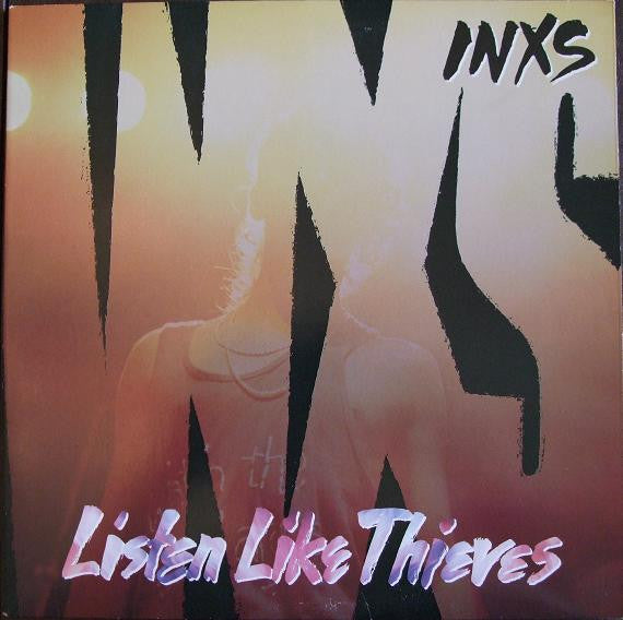 Album cover for INXS' 'Listen Like Thieves' with stylized text and silhouette.