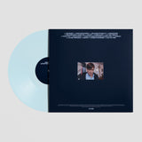 Vinyl record with a blue disc and black cover featuring a small video clip on a light gray background