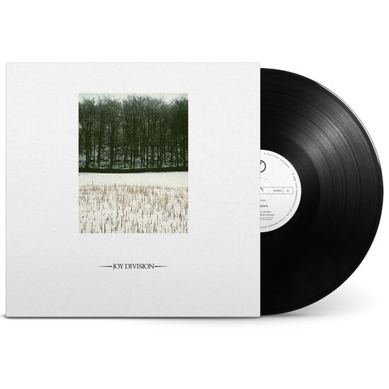 Vinyl record with a white cover featuring a black and white photo of a landscape, on a white background.