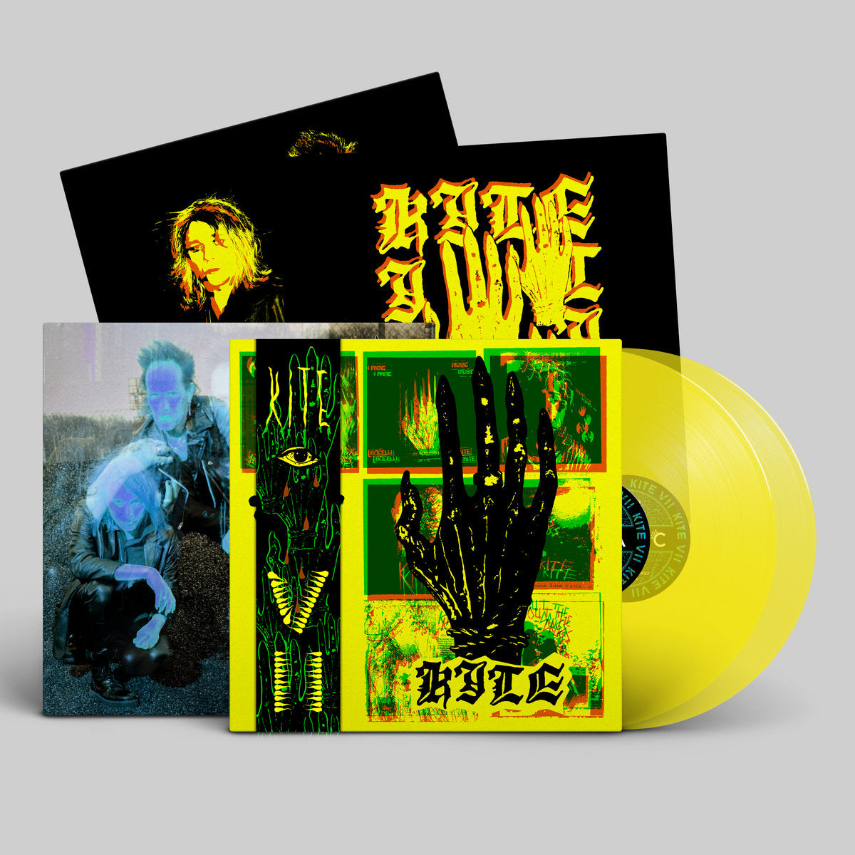 Vinyl record with colorful cover featuring artistic designs and a yellow disc.