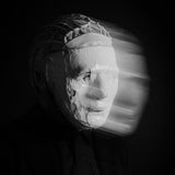Album cover for Kontravoid's 'Detachment' featuring a person wearing a mask with a blurred background