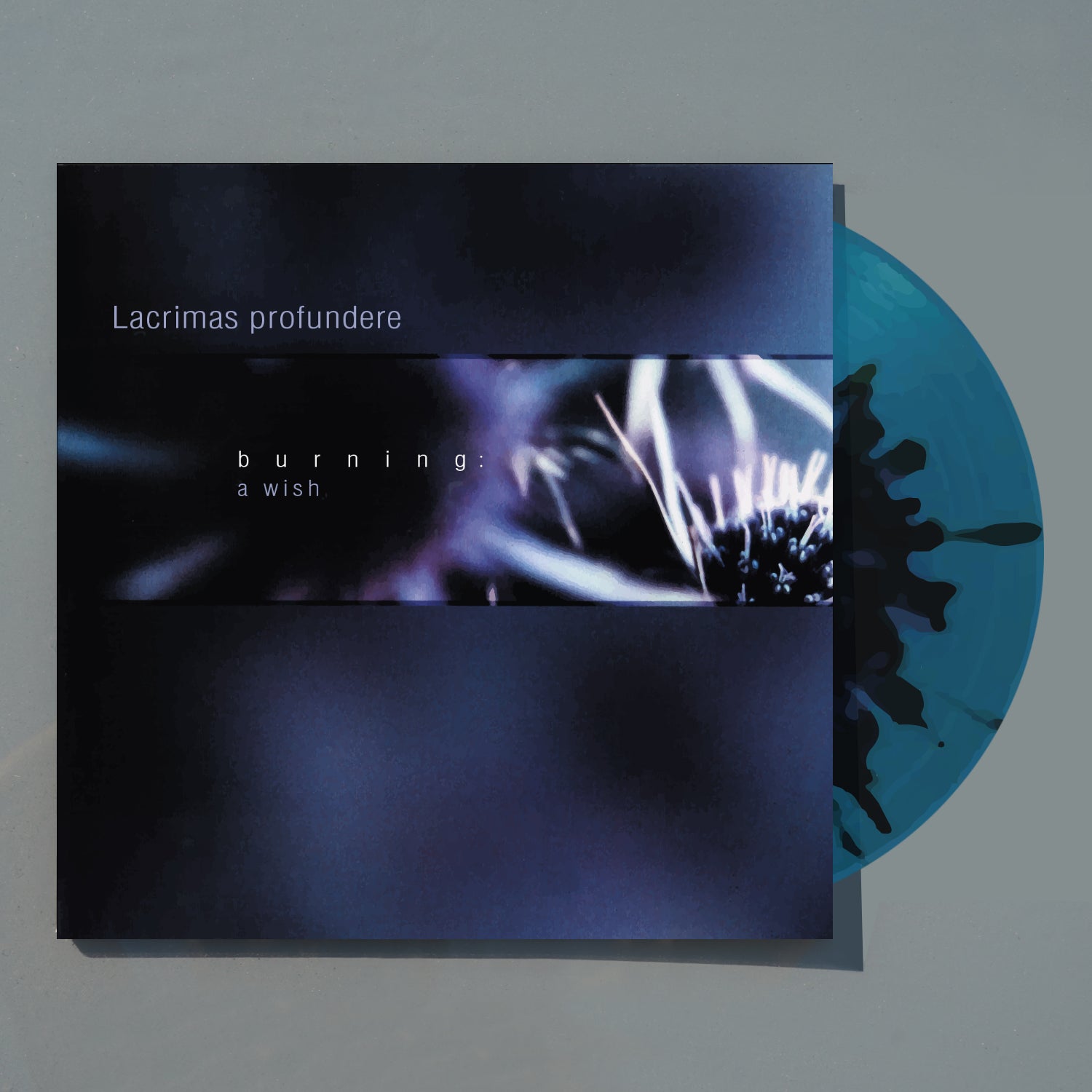 Vinyl record with a dark cover featuring abstract designs and text.