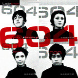 Album cover for Ladytron's '604' featuring the band members portraits and branding on a patterned background.