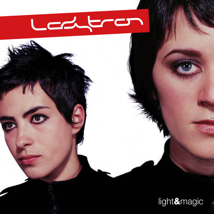 Album cover for Ladytron's 'Light & Magic' with two band members featured on cover.
