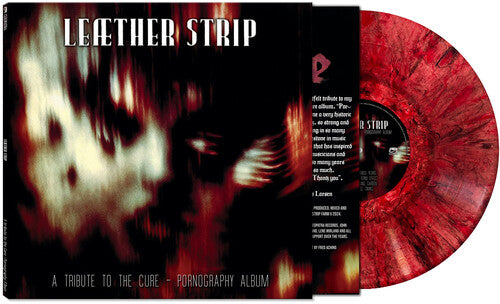 Vinyl record with red and black design and cover featuring abstract art.