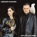 Album cover showing two people, one holding flowers and the other with a parrot on shoulder, against a dark background with 'Lebanon Hanover' and 'Asylum Lullabies' text.