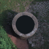 Lebanon Hanover - Besides the Abyss album cover featuring a circular stone structure and nature-themed design.