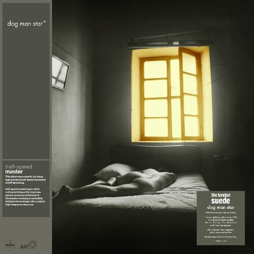 The London Suede - Dog Man Star (30th Anniversary Edition album cover with a person lying on a bed under a window with warm light