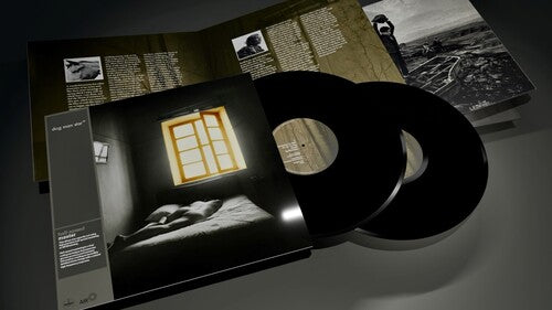 The London Suede - Dog Man Star (30th Anniversary Edition black vinyl records with cover and text on a dark surface
