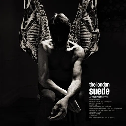 Album cover with a person sitting between two hanging animal carcasses, featuring the text 'The London Suede - Antidepressants'