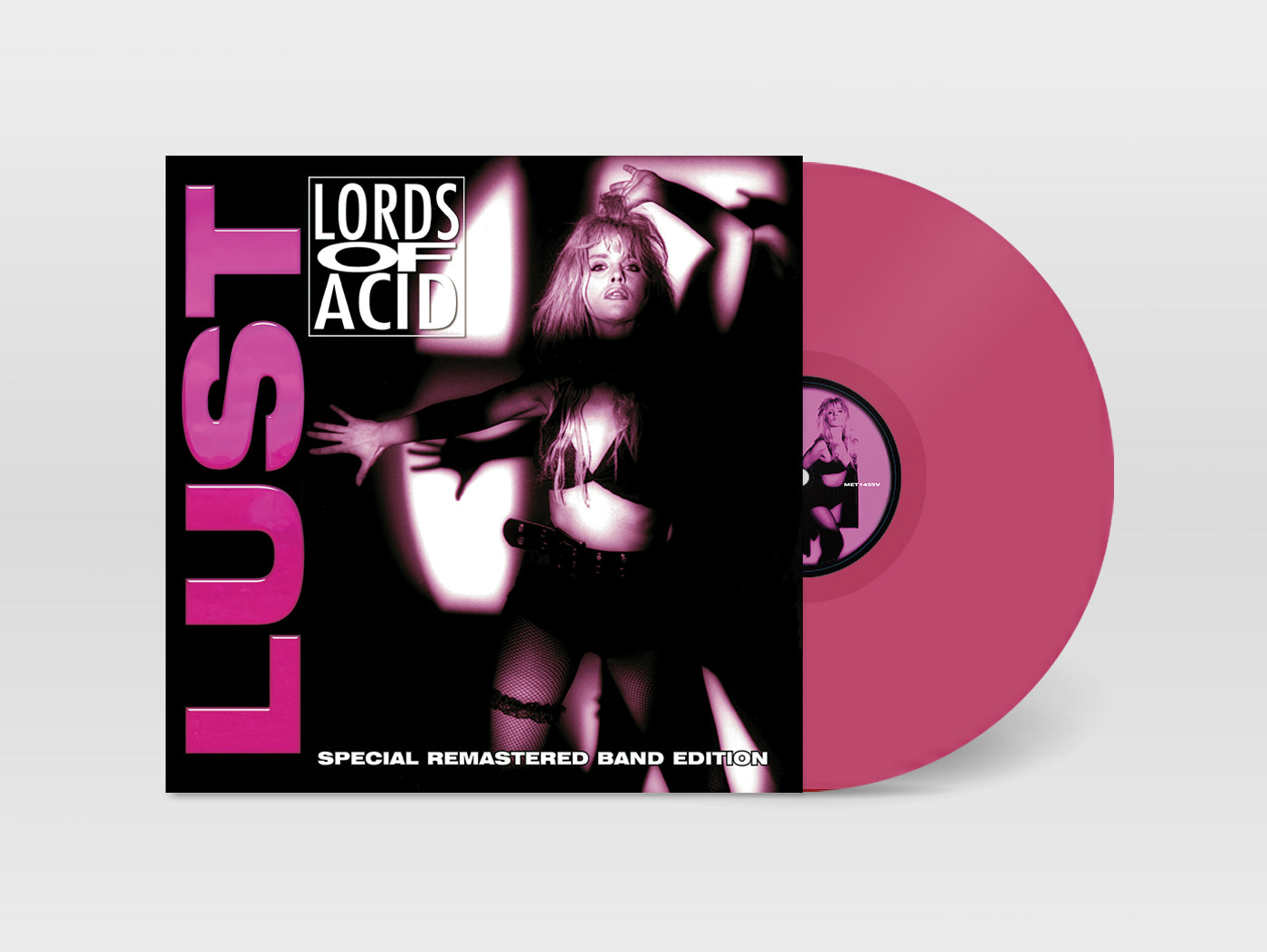 Vinyl record with 'Lords of Acid' cover featuring a woman and the word 'Lust'.