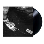 Vinyl record with a black and white image of a hand holding a knife on the cover