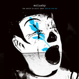 Album cover with a stylized clown face and text 'mclusky the world is still here and so are we' on a black background