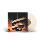 Vinyl record with a cover featuring architectural design on a white background